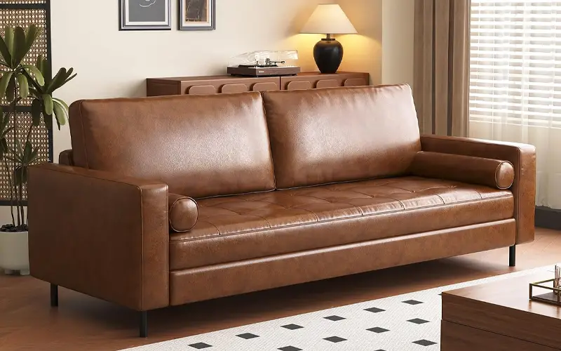 mid century modern faux leather sofa with tufted cushions feature 1